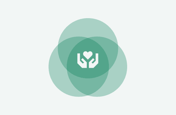 Icon of two hands holding a heart, symbolizing care and support, centered within a green overlapping circular background.