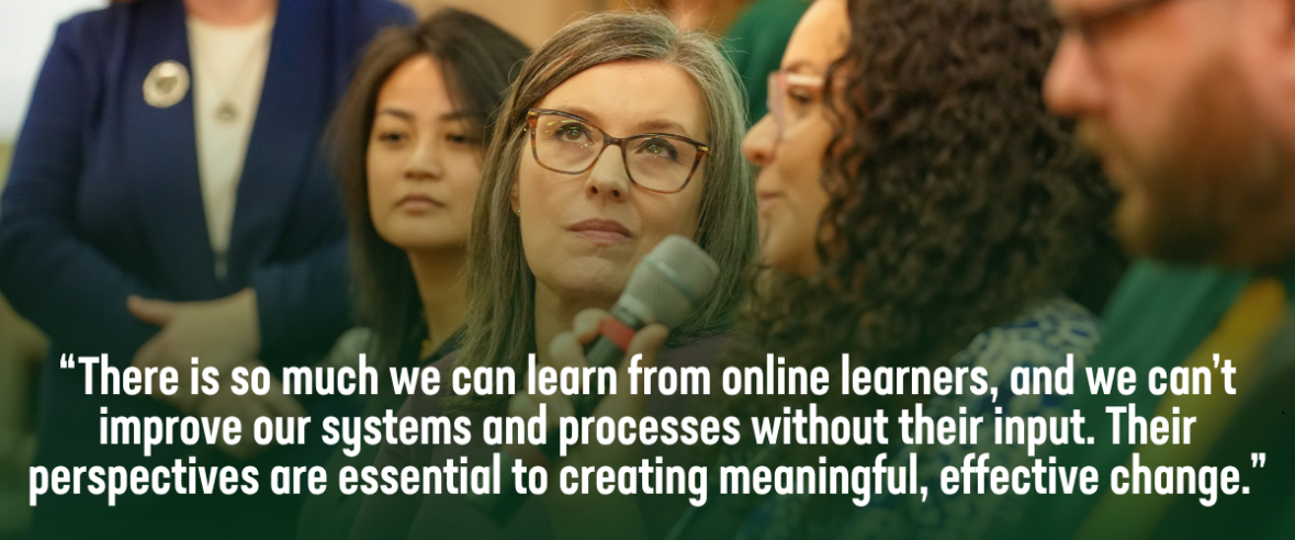 A horizontal banner showing a close-up of a group of UNC Charlotte online program alumni in a discussion setting at the Online Learning Symposium. A woman in the foreground holds a microphone, while others look on attentively. Overlaying the image is a quote in white text: "There is so much we can learn from online learners, and we can’t improve our systems and processes without their input. Their perspectives are essential to creating meaningful, effective change.
